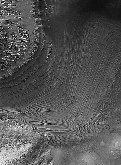 Cross-cutting layered rock exposure in Galle Crater.