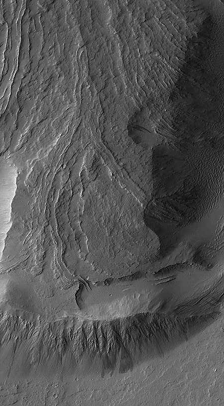 Lava flows, mantled with dust; one leveed lava channel disappears into the dust.