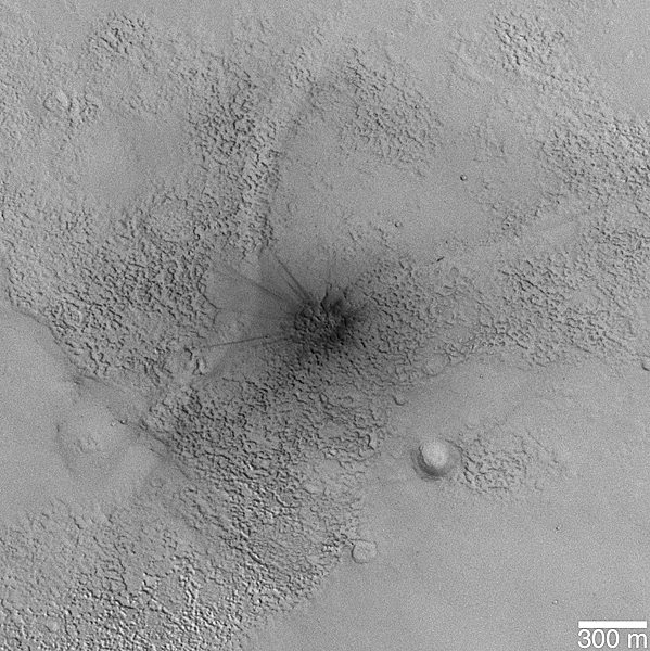 Small fresh impact crater in rugged north mid-latitude terrain.