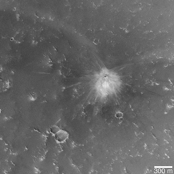 Large view of impact site; small dark crater at center of light-toned ejecta and rays.