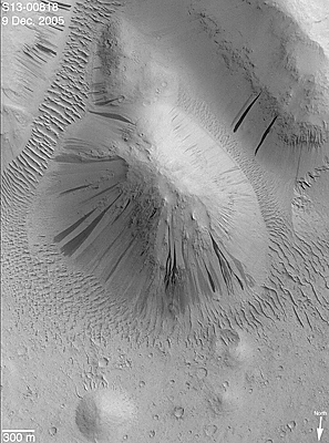 Dark slope streaks with spectacular evidence of dry, granular flow.